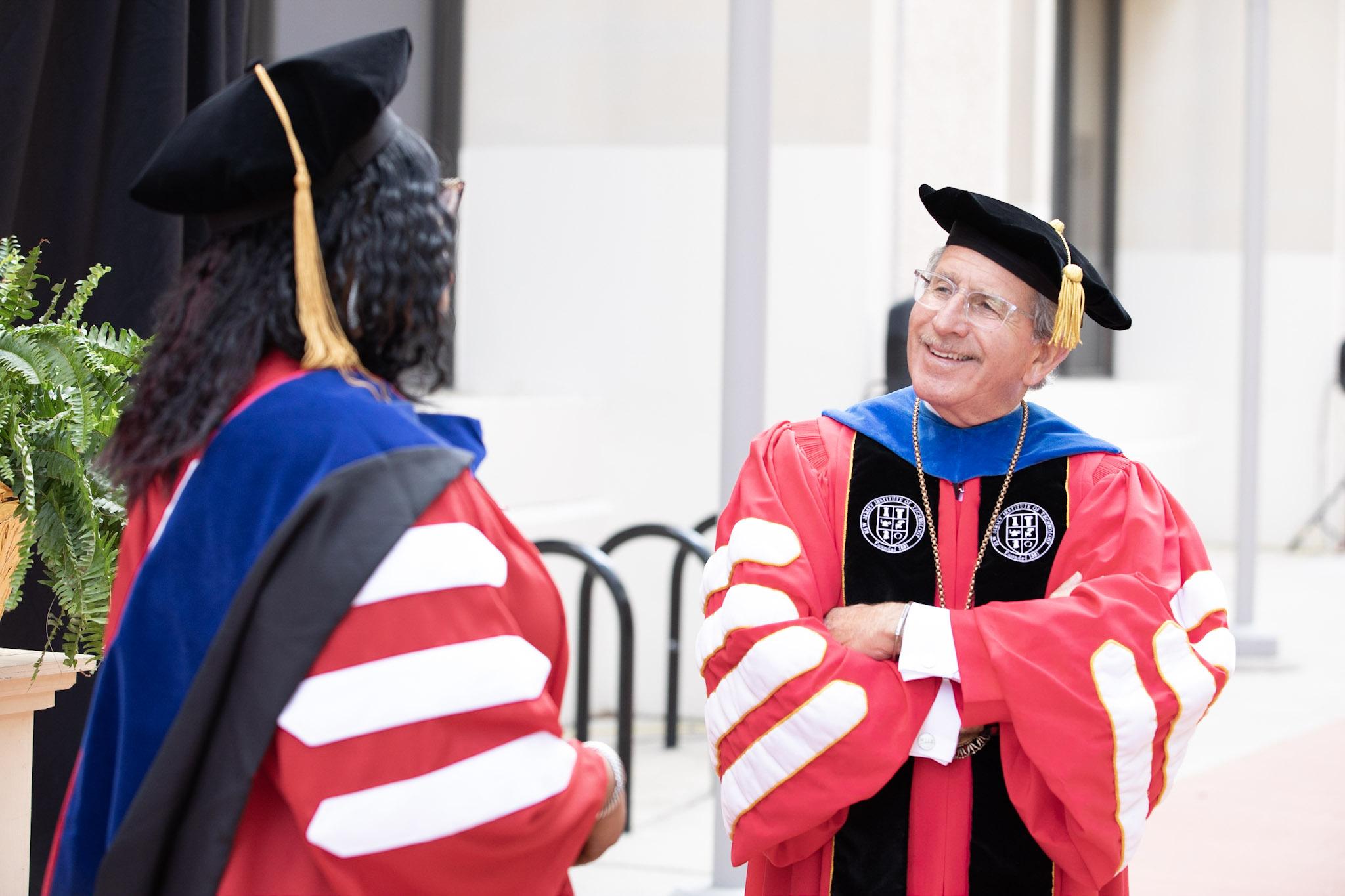 NJIT President Joel S. Bloom with Ph.D. graduate speaker Ogochukwu Enekwizu