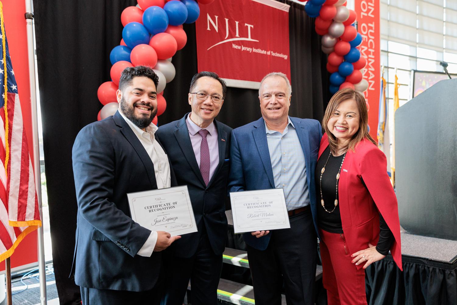 Alumni Jose Espinoza '10 and Robert Medina '75 with President Teik C. Lim and First Lady Gina Lim.