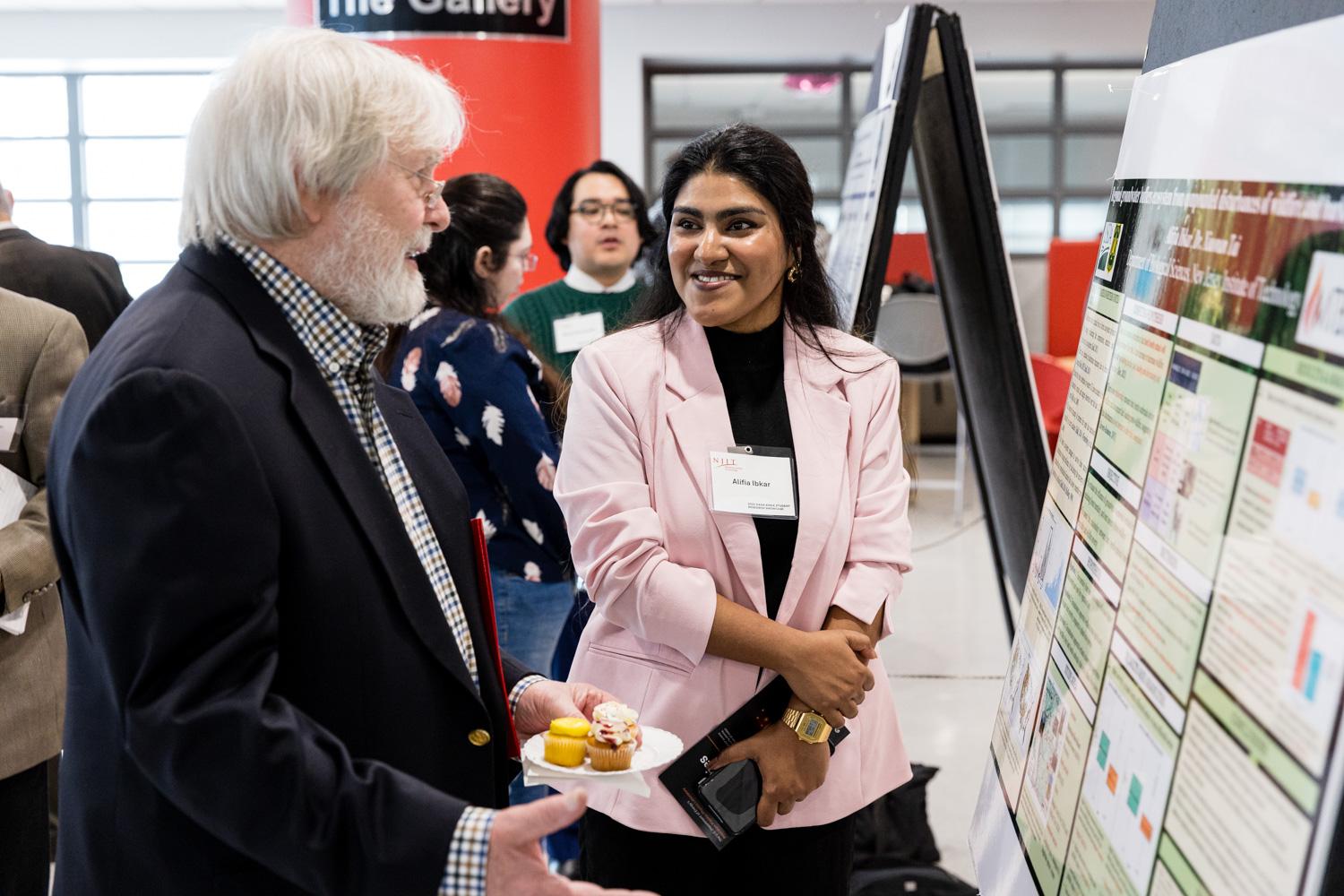 Graduate student Alifia Ibkar presents research into the relationship between bark beetle-induced tree mortality and wildfire severity.