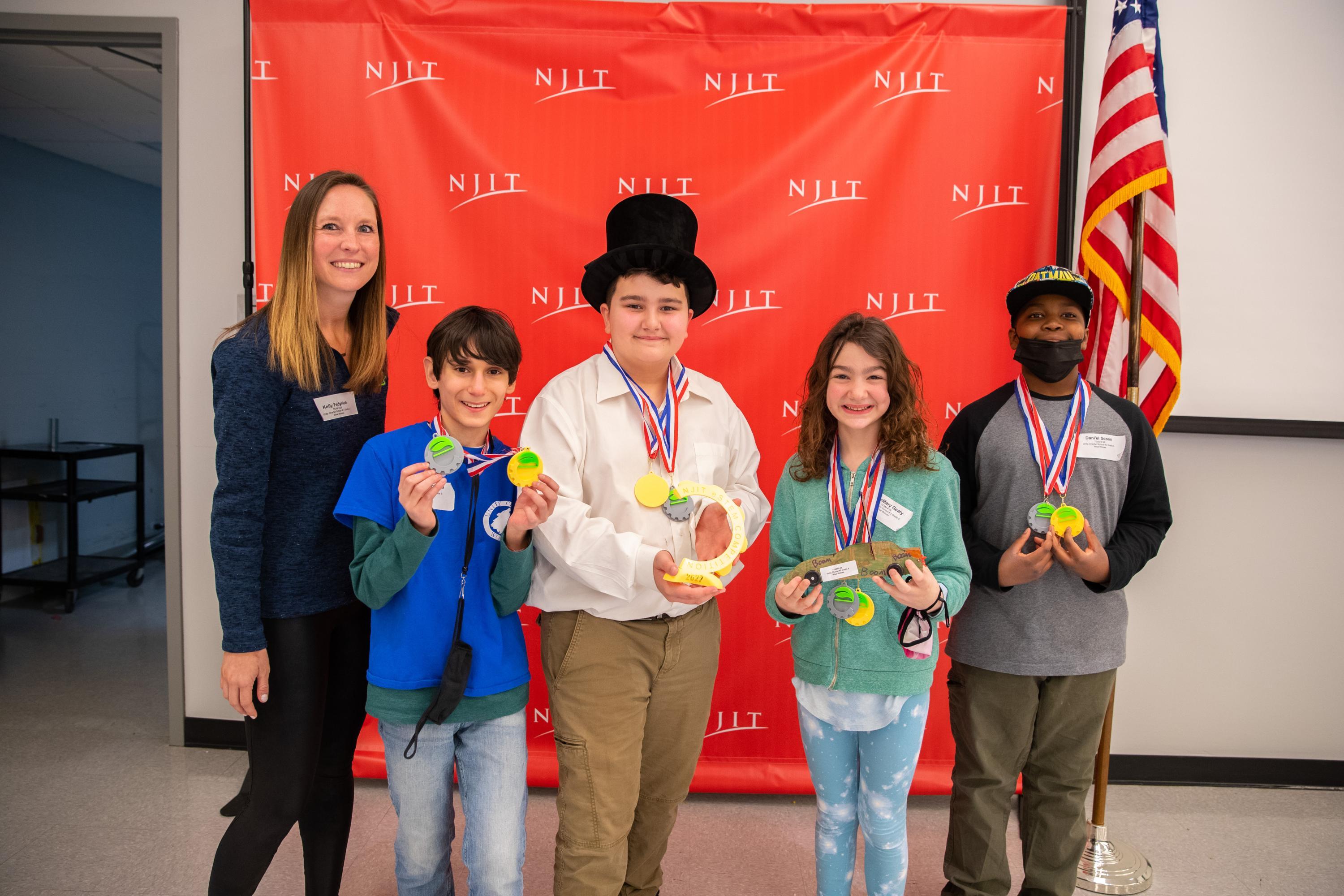 The winning team from Morristown Unity Charter School. Left to right: teacher Kelly Fedynich; students Johnnie Giannella, Paul Sheffield, RoseMary Geary, Dani'el Scoon