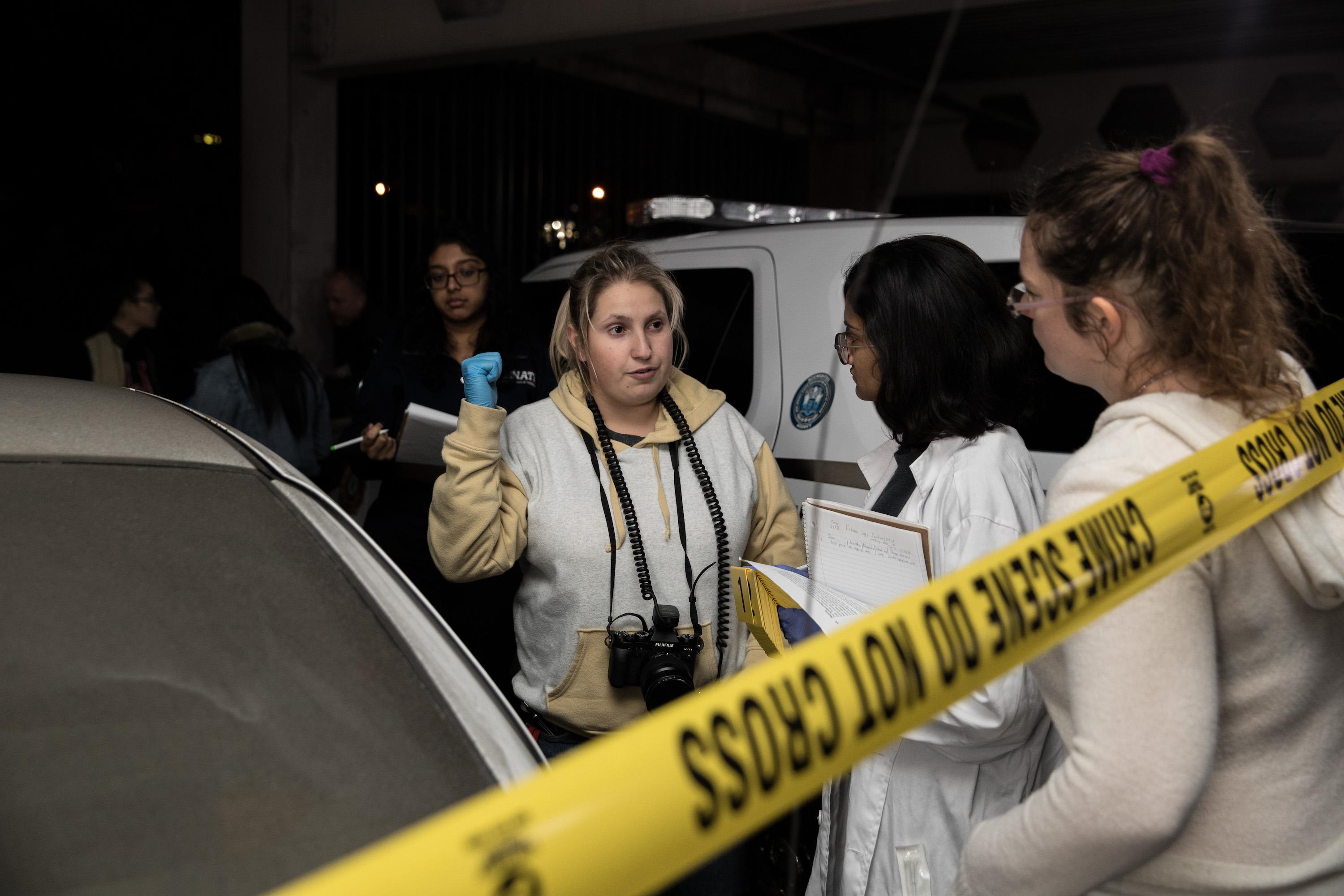 Sroka leads the team's forensic photography detail at the scene.