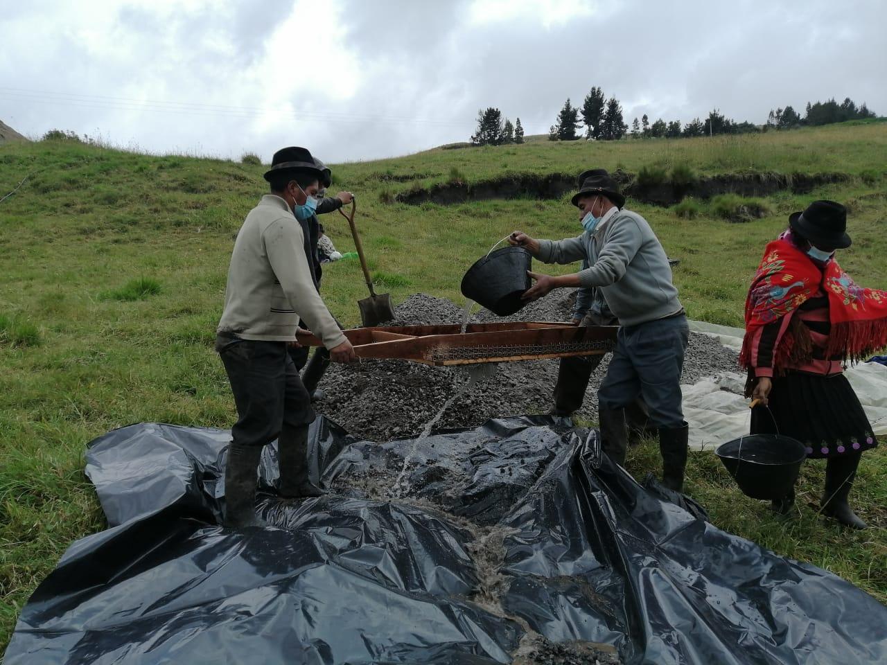 Community members used cement to lay a cutoff wall to prevent the water from draining into the ground. 