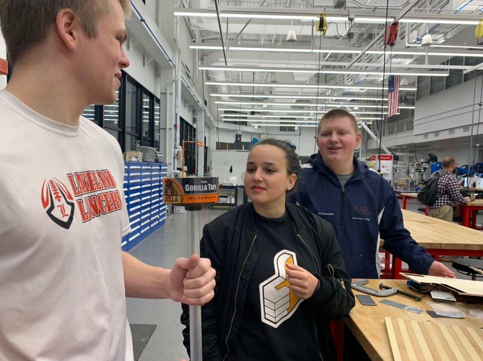 Students Lauren Hutnik and Joshua Gaughan prepare to assemble their design (drawing below) in NJIT's Makerspace. 