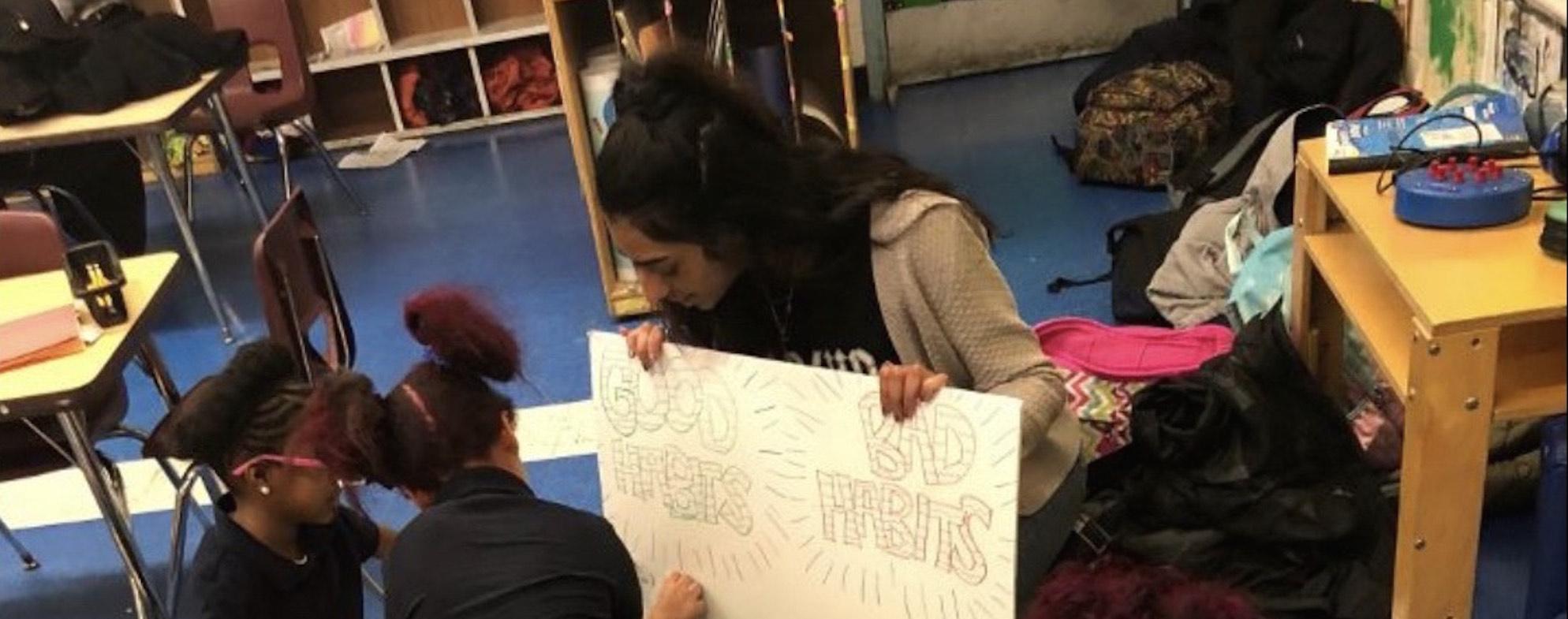 Abigail Varughese teaches students about healthy habits as part of the Healthy Heroes Program.