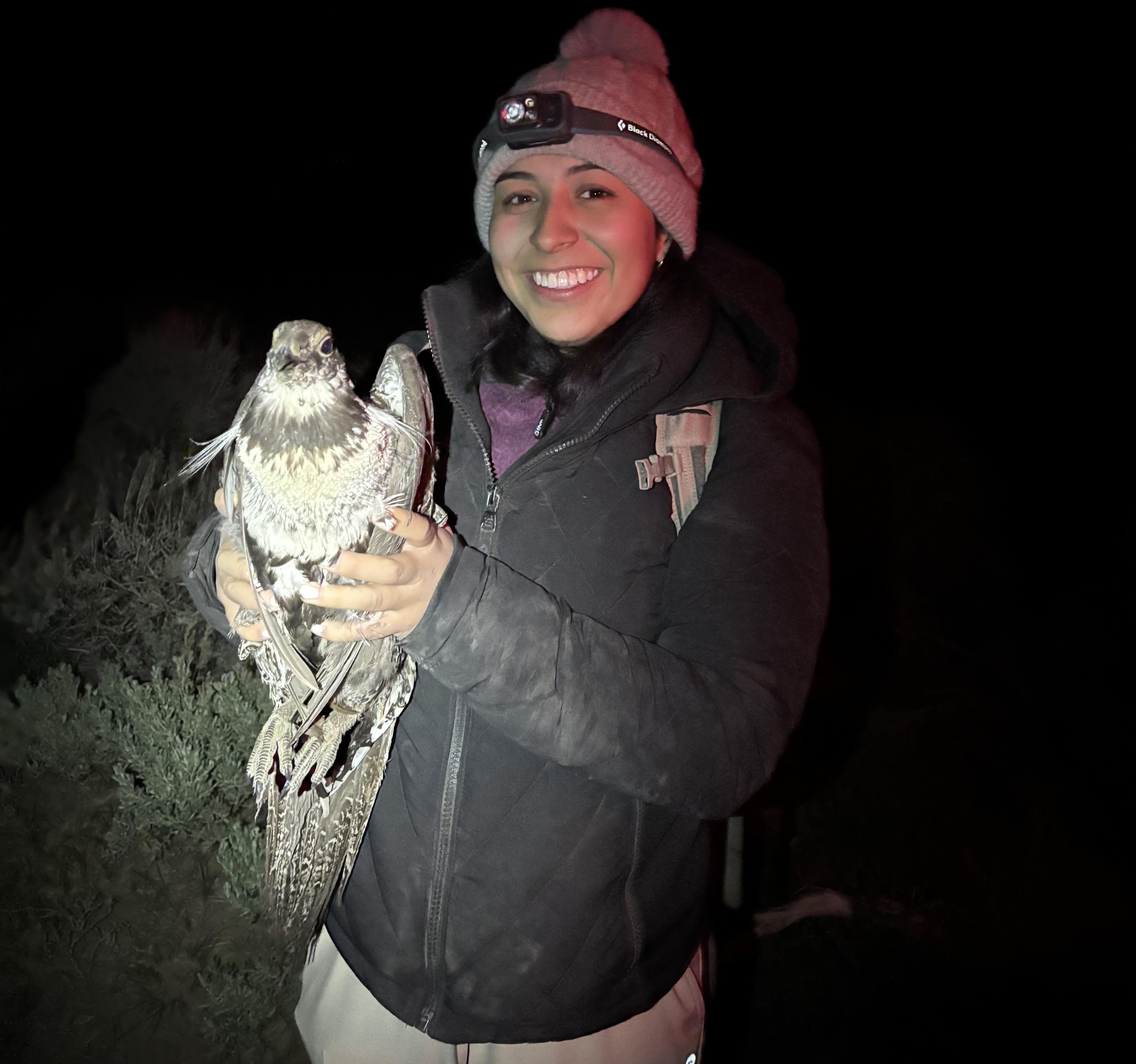 Sanchez Hernandez holding a Greater Sage-Grouse. 
