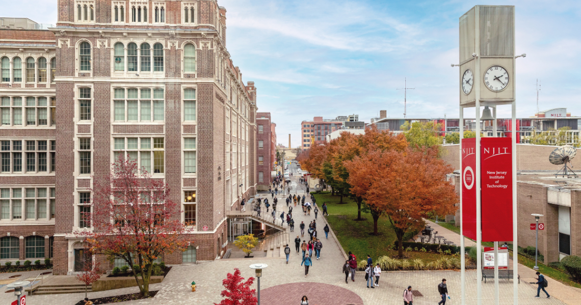 NJIT campus featuring trees changing color in fall, NJIT clocktower and Central King Building