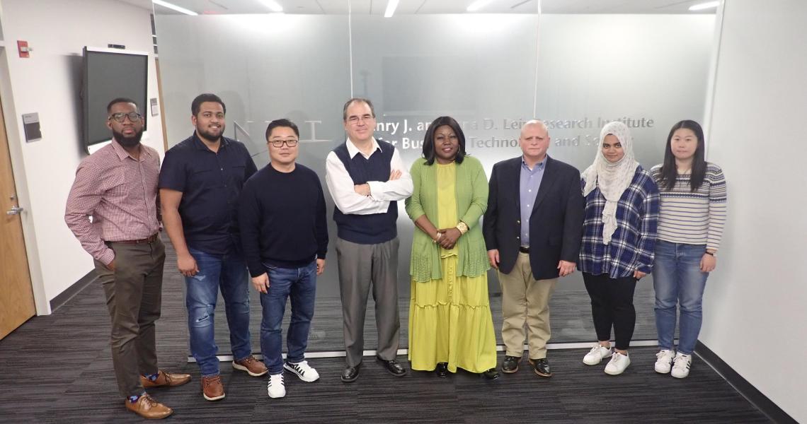 Associate Professor of Entrepreneurship Cesar Bandera (fourth from left) with Entrepreneurial Strategy students (from left) Gary White, Araviind Krishnaraj, Yujae Yi, Rita Tabe, James Colonias, Hana Sherza and Yiting Zhu