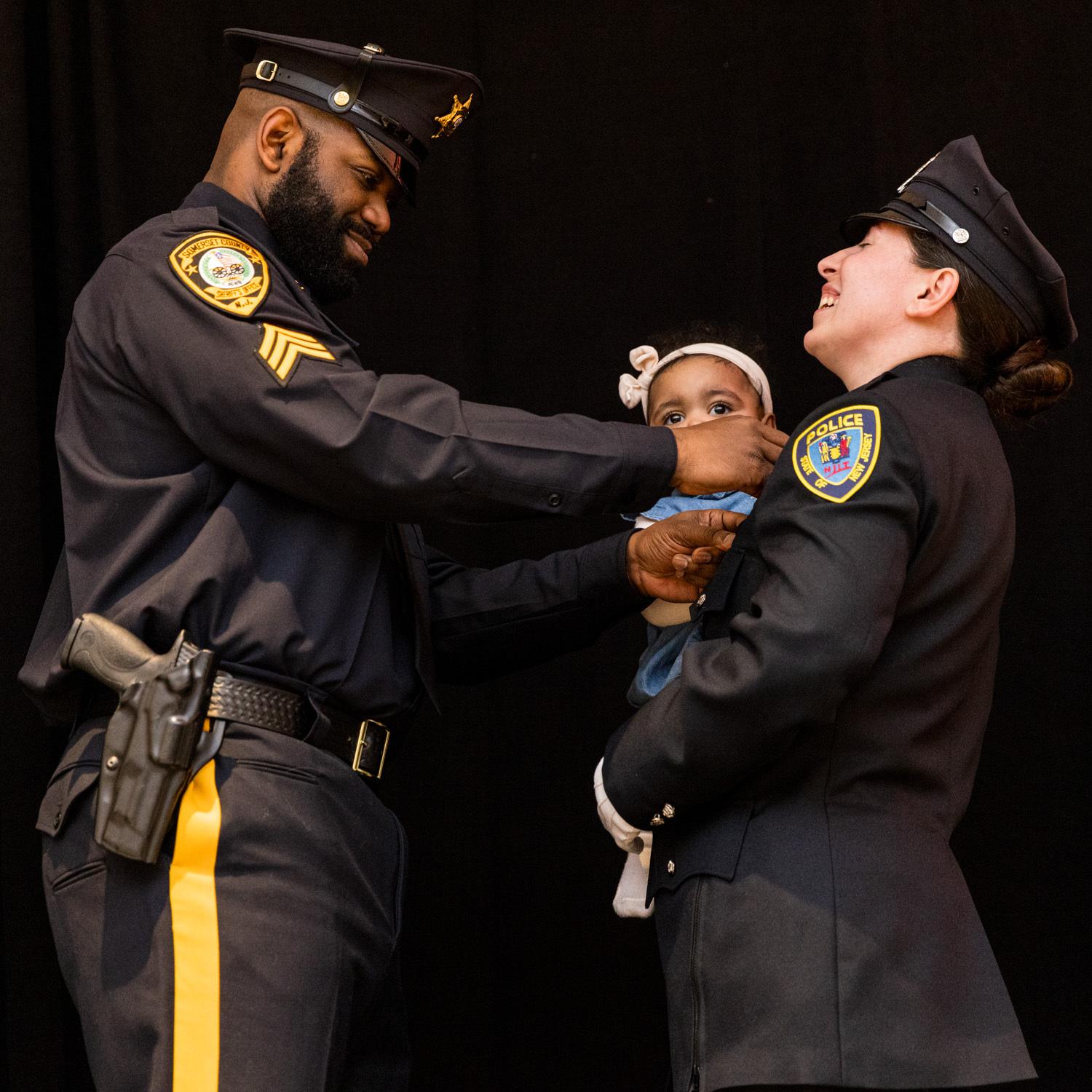 Swearing in: new Officer Sonia Bellamy (R) with daughter Sariyah and husband James of the Somerset County Sheriff's Office